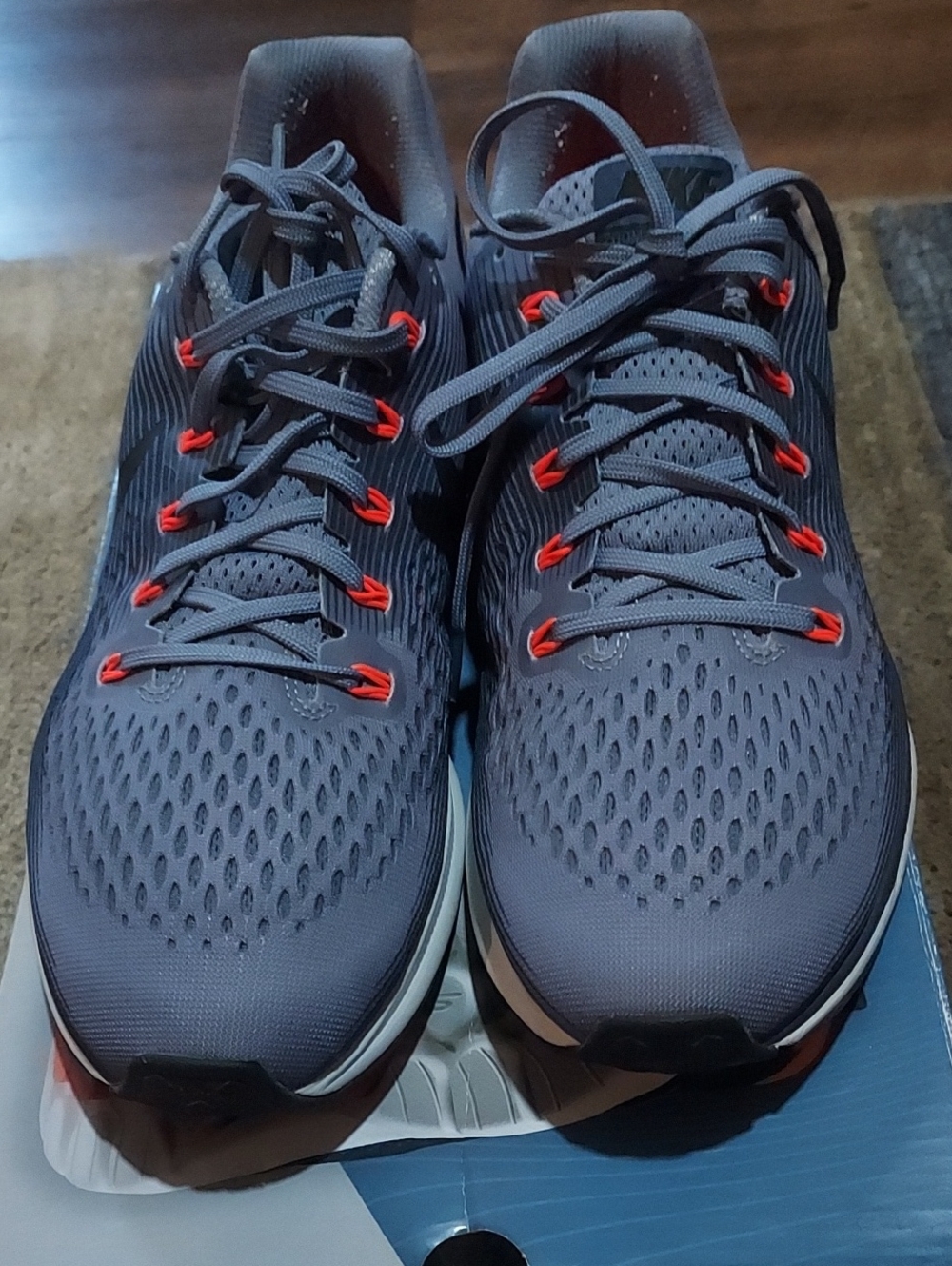Nike Men's Gray Running Shoes with Red Eyelet Accents